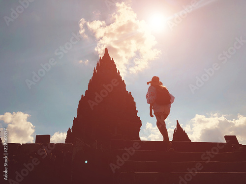 Beautiful woman enjoying the view of Prambanan temple in Yogyakarta. photo