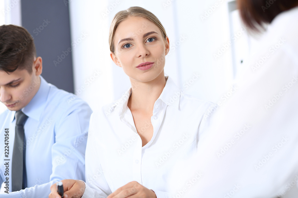 Group of business people or lawyers discussing terms of transaction in office. Meeting and teamwork concept Group of business people or lawyers discussing terms of transaction in office. Meeting and teamwork concept