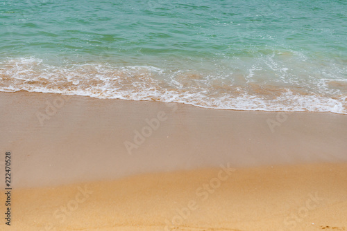 soft wave of an ocean on a sandy beach