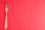 wooden fork in color background