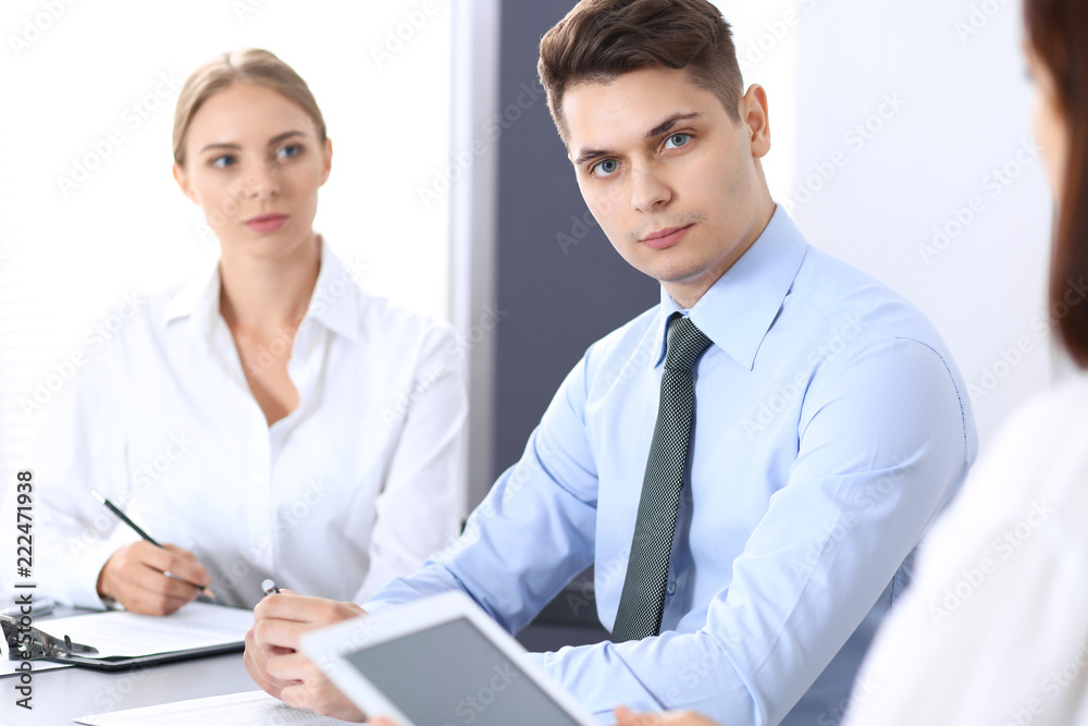 Group of business people or lawyers discussing terms of transaction in office. Meeting and teamwork concept Group of business people or lawyers discussing terms of transaction in office. Meeting and teamwork concept