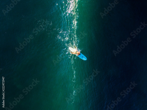 vertical longboard surfergirl bali indonesia canguu oldmans paddle out fine lines © Tim