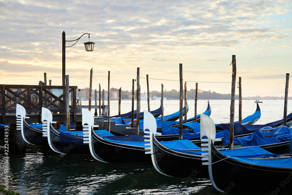 Gondolas in Grand Canal in the early morning in Venice, Italy