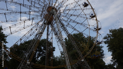 ferris wheel on background of blue sky