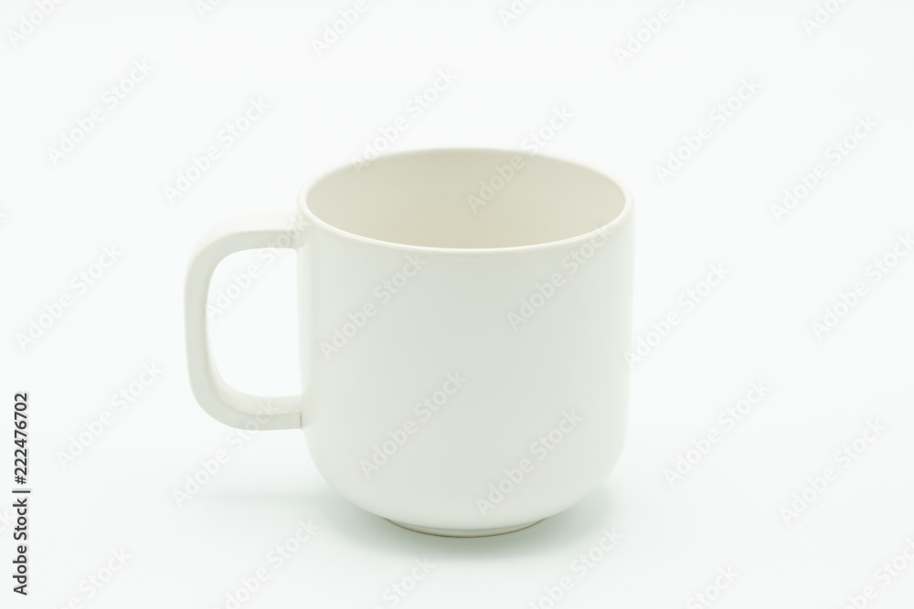 White coffee mug located in the middle of the picture. Has a white background As a raw material of the media. with copy space. White coffee mug located in the middle of the picture. Has a white background As a raw material of the media. with copy space.