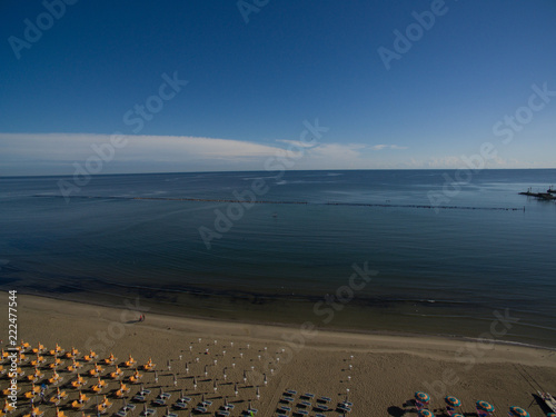 cesenatico ambrellas Mediterranean aerial shot sunrise blue horizon beach italy photo