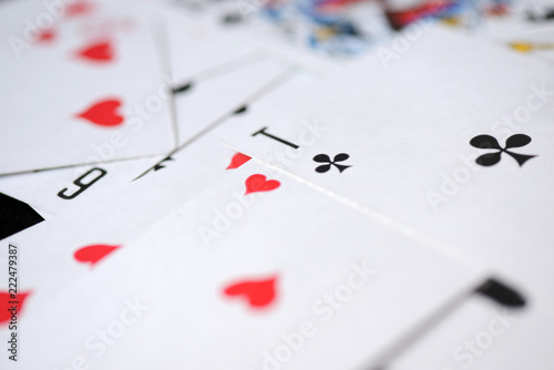 Background of playing cards scattered on a table close up