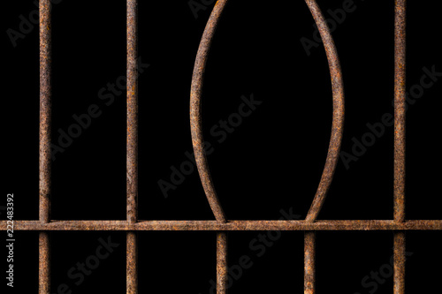 Broken old prison rusted metal bars on black background, concept of escape