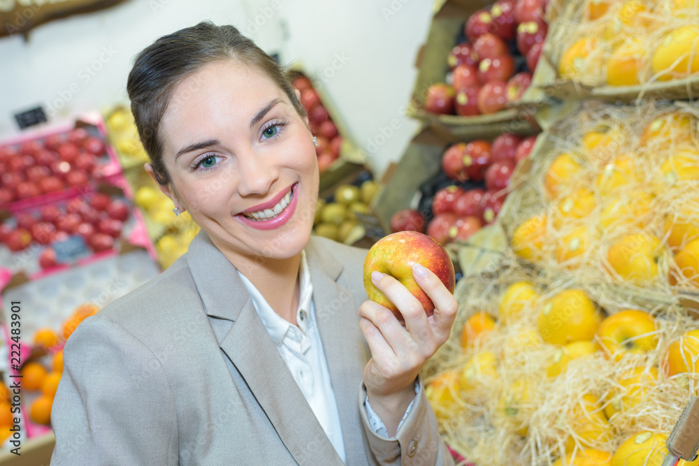 pretty woman buying fresh fruits and vegetables at food-store pretty woman buying fresh fruits and vegetables at food-store