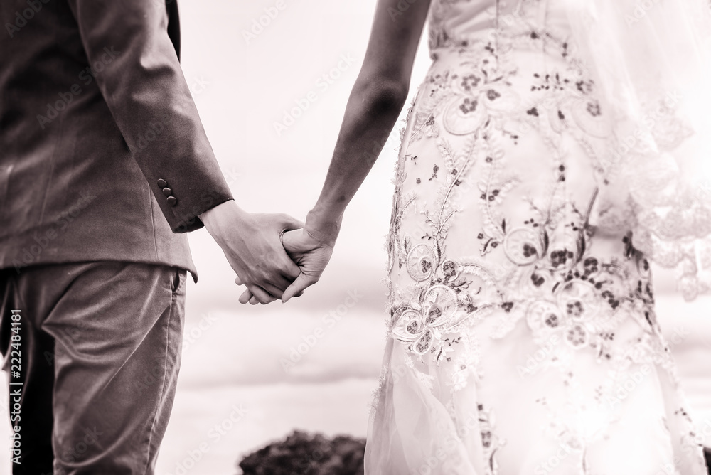 The abstrat art design background of the weddding couple,holding hand together,blurry light around The abstrat art design background of the weddding couple,holding hand together,blurry light around