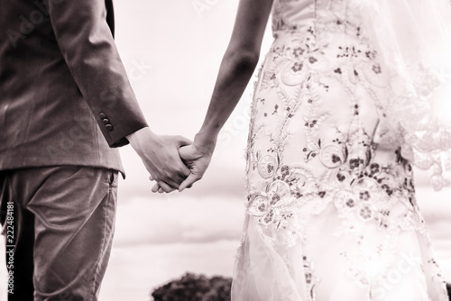The abstrat art design background of the weddding couple,holding hand together,blurry light around