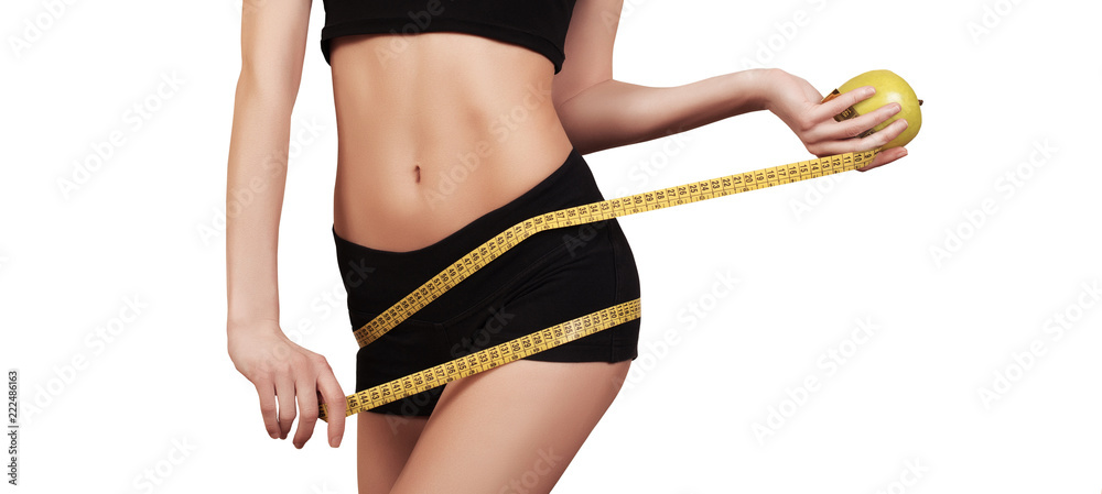 Slim Female with perfect healthy fitness body, measuring her thin