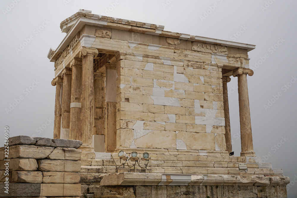 Athens, Greece: The Temple of Athena Nike, 421-405 B.C.E., at the Acropolis  of Athens, under a hazy sky caused by dust pollution. Stock Photo | Adobe  Stock