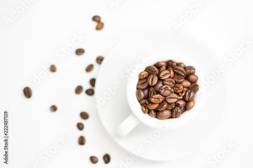 coffee cup full of roasted coffee beans