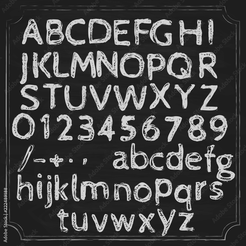 Alphabet written chalk on a blackboard. Letters in two registers and numbers. Punctuation marks.