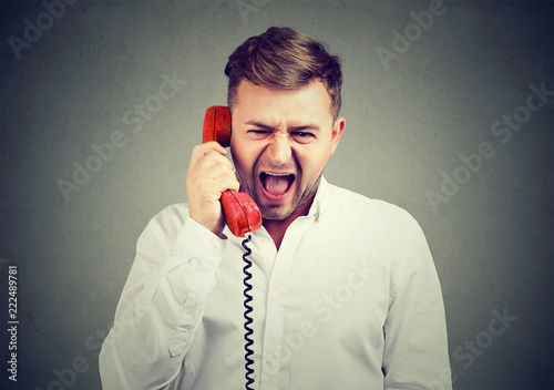 Angry man screming on the phone