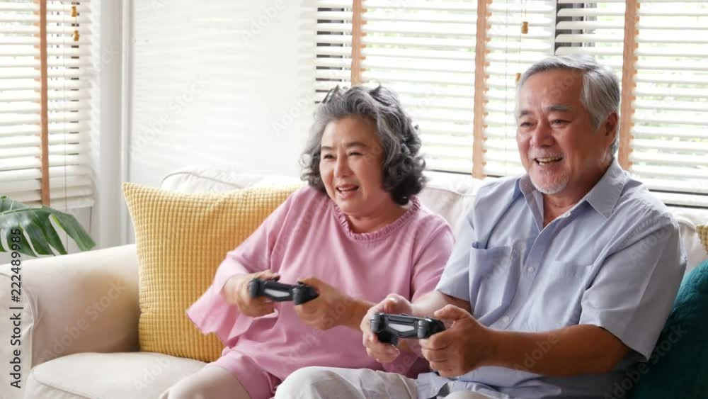 Senior man and woman playing game together at home with happy emotion. People with happy, lifestyle, entertainment concept. 4k resolution. Senior man and woman playing game together at home with happy emotion. People with happy, lifestyle, entertainment concept. 4k resolution.
