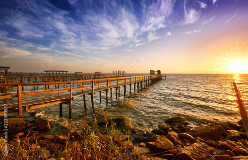 Fotografija Long wooden docks reach into Galveston Bay, Texas, at sunrise