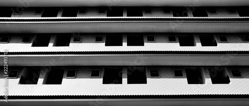 underside angle view of modern building skyscrapers roof - monochrome