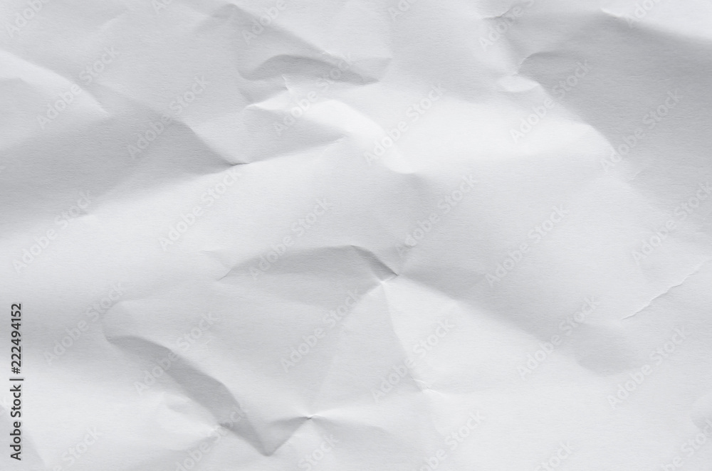 Fototapeta premium Białe tło i tapeta dzięki zmiętej fakturze papieru i wolnej przestrzeni.