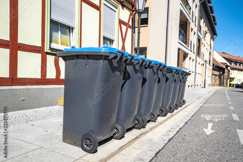 Eight garbage cans on the street © Polarpx