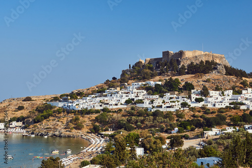 Medieval fortress and white houses of Lindos village in Rhodes..