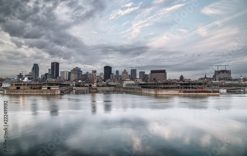 Montreal skyline reflected on the river on a cloudy morning