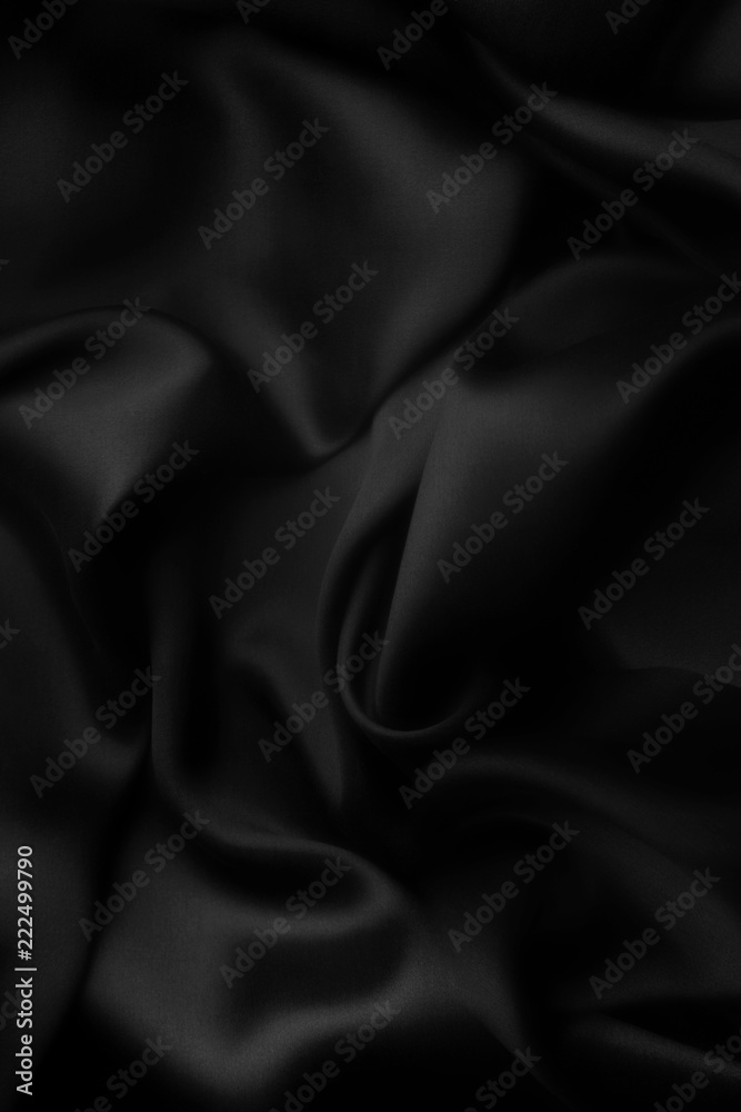 Fototapeta premium Elegant black satin silk with waves, abstract background.