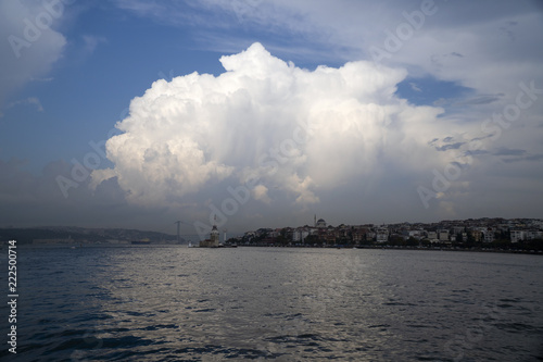 The Istanbul Bosphorus and beautiful cumulus cloud with reflections and The Maiden's Tower 