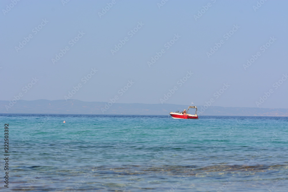 Afytos beach in Greece, rocks and blue sea Afytos beach in Greece, rocks and blue sea