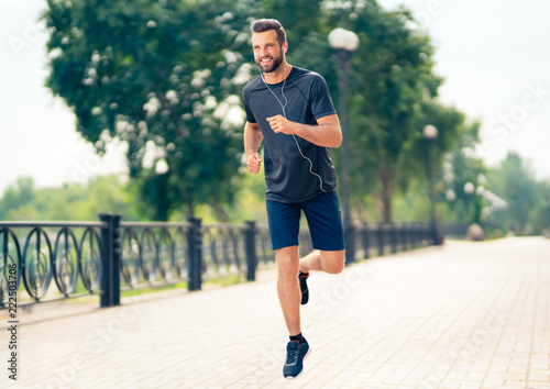 Happy man during morning jogging, outdoors