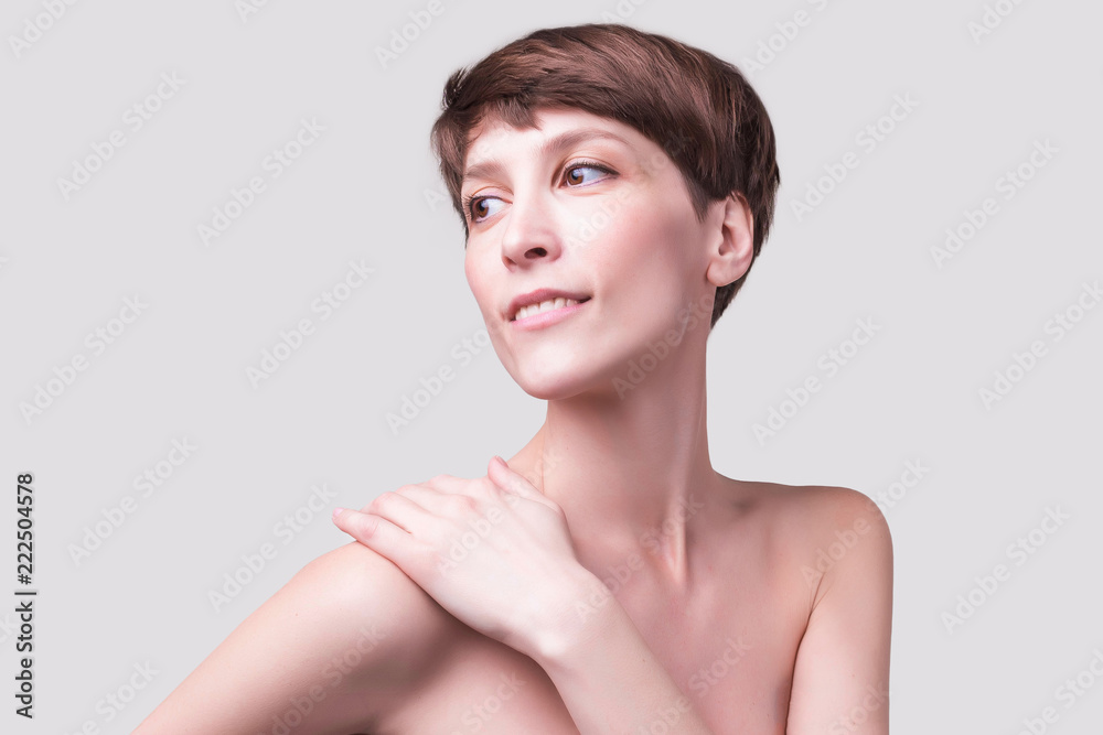 Beautiful woman. Female face close up. Portrait of young caucasian woman at studio isolated on white. Fresh skin and beauty concept. Short haircut, long neck, perfect skin Beautiful woman. Female face close up. Portrait of young caucasian woman at studio isolated on white. Fresh skin and beauty concept. Short haircut, long neck, perfect skin