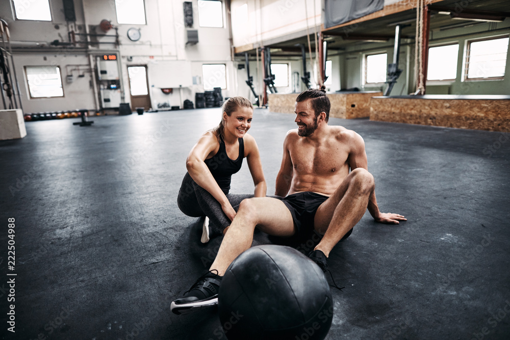 Fit young couple taking a break from working out together Fit young couple taking a break from working out together