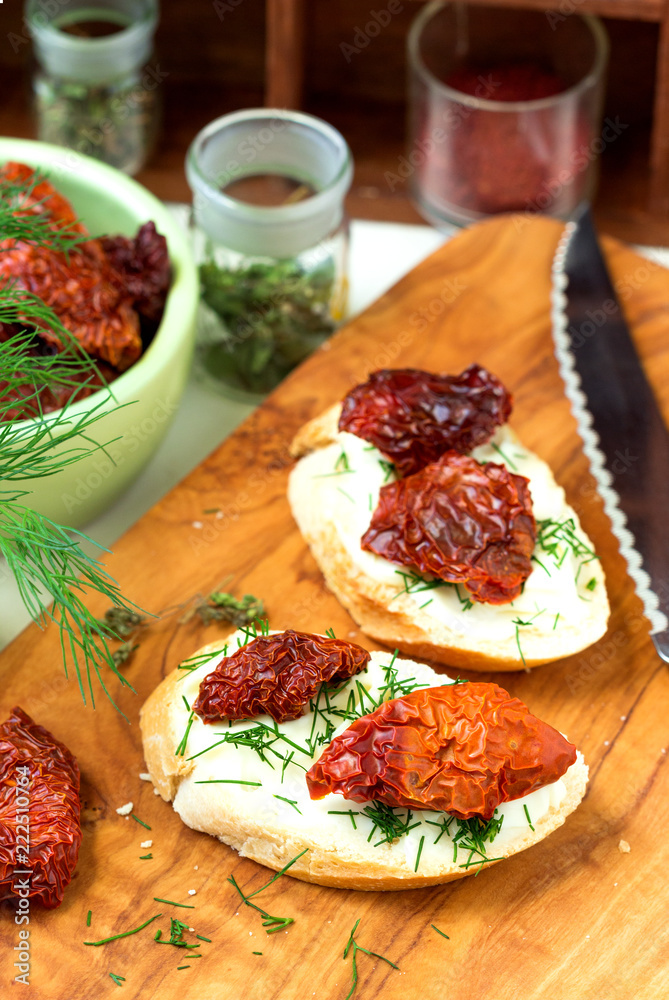 Sandwiches with dried tomatoes, cheese and greens. Sandwiches with dried tomatoes, cheese and greens.