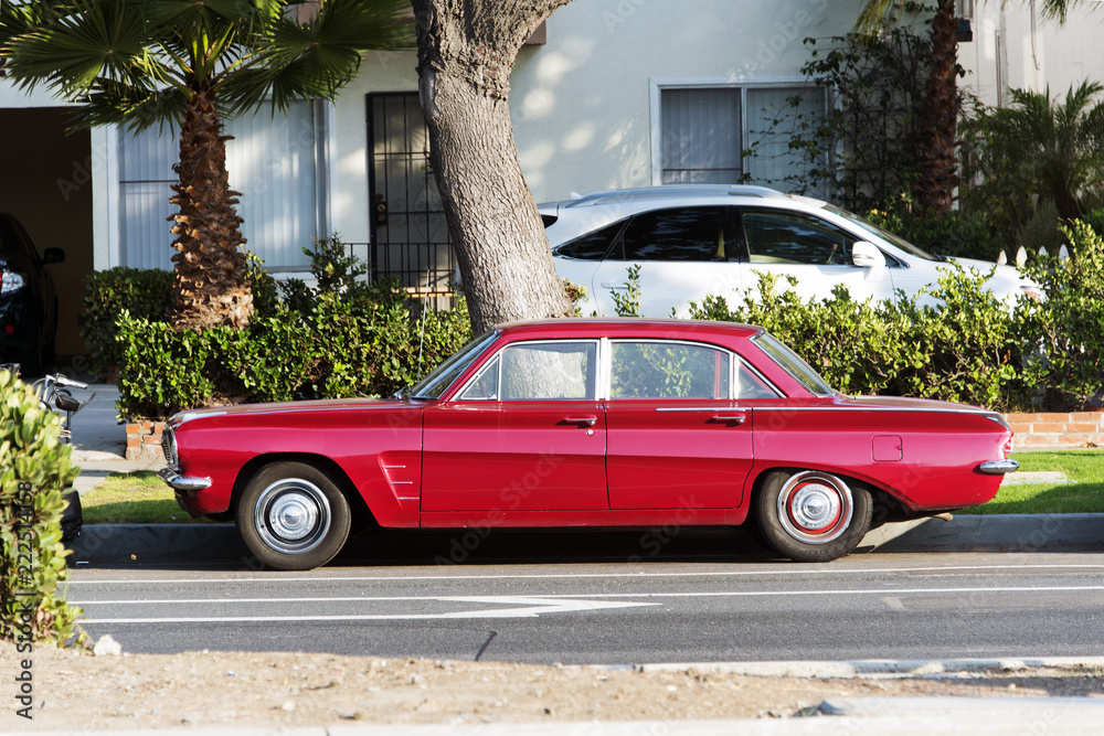 A view of a vintage classic American red car in the street in LA