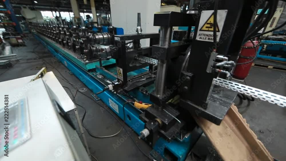 Profiles are created on the metal rolling machine at the plant ...