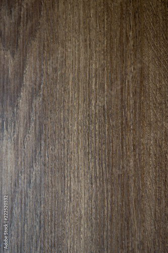 Texture of brown wooden board for furniture. Dark background. 