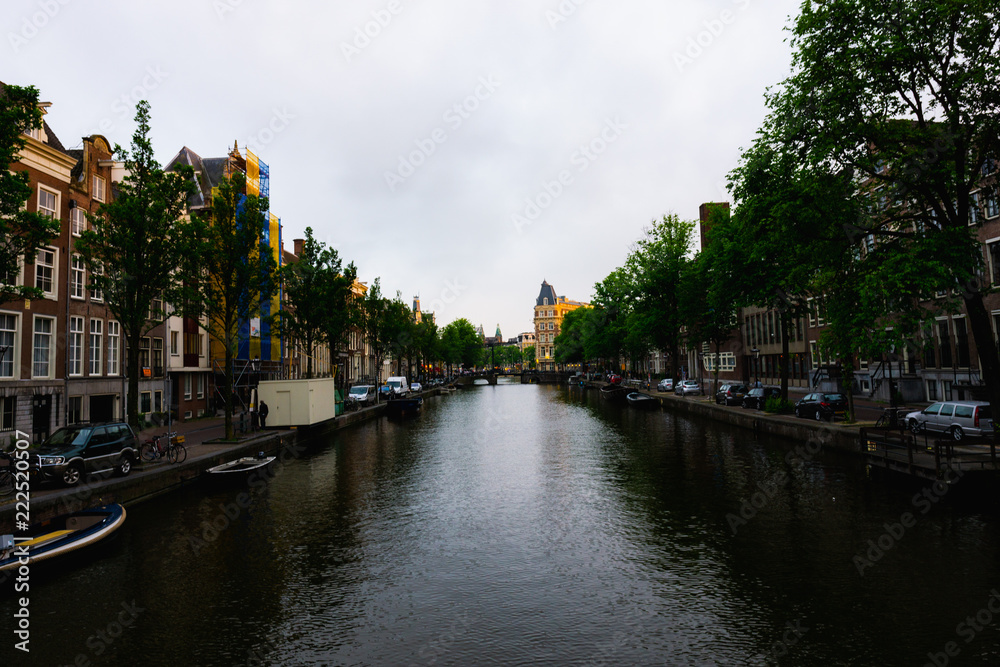 Amsterdam, Netherlands - June 3, 2018: A view of a canal in Amsterdam