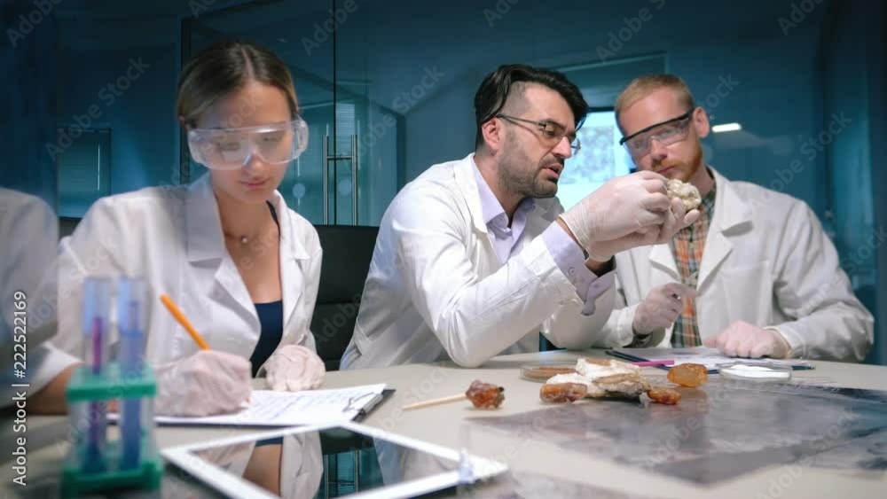 Scientists study the rare mineral in laboratory Scientists study the rare mineral in laboratory