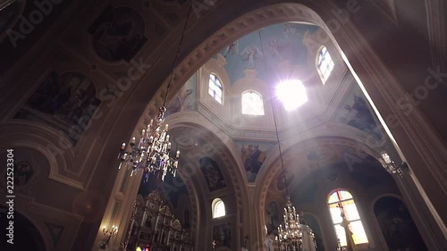A ray of light through the chandelier in the cathedral photo