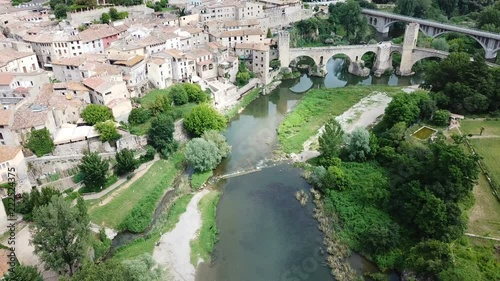 Aerial view of historic centre of Besalu with Romanesque bridge over Fluvia river, Catalonia, Spain photo