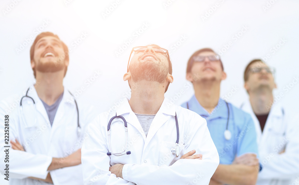 confident medical team looking up.isolated on white confident medical team looking up.isolated on white