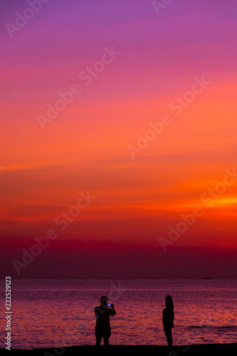 couple on the beach on sunset