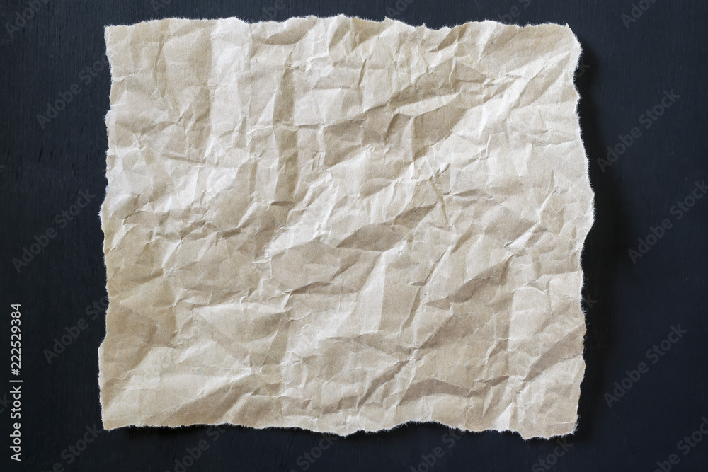 Crumpled paper on a black background. Crumpled paper on a black background.