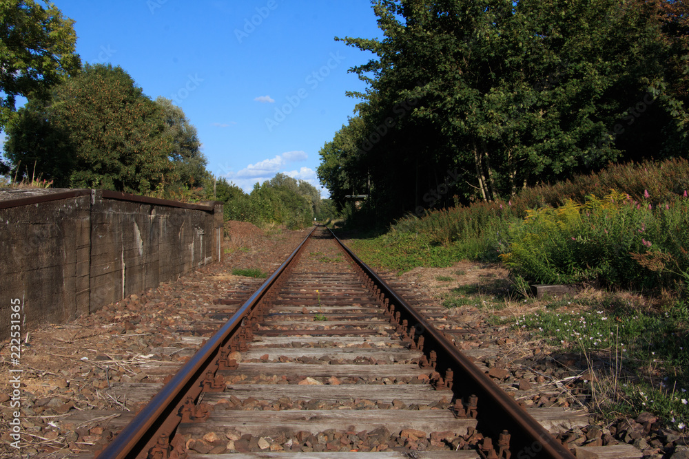 single train track on lost places trainstation