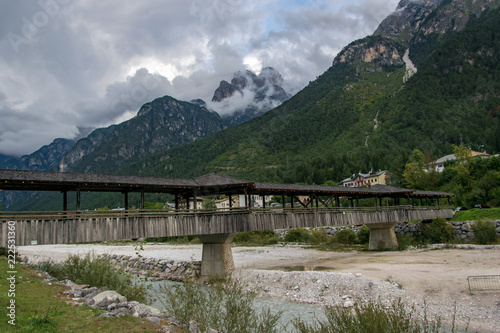 Wooden bridge over mountain river