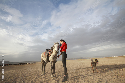 white horse and beautiful young woman. Fashion model with her white horse  Freedom  happiness  summer. Love 