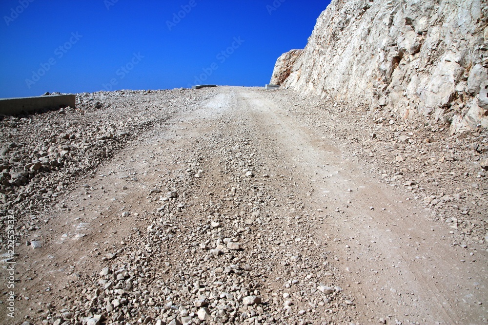Macadam road in infinitte waz dissapearing in clear sky Macadam road in infinitte waz dissapearing in clear sky