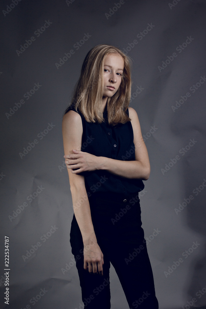 Portrait of a young smiling woman isolated on background with copy space Portrait of a young smiling woman isolated on background with copy space