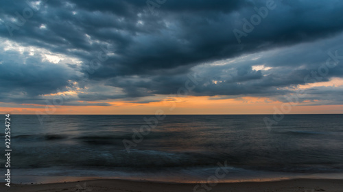 the clouds covers the sea in the evening